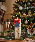 Nutcracker Festive Spice Christmas tube candle lit with nutcracker soldier design glowing