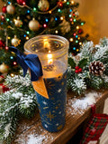 Cinnamon and Blackberry Christmas tube candle lit with navy star constellation design glowing