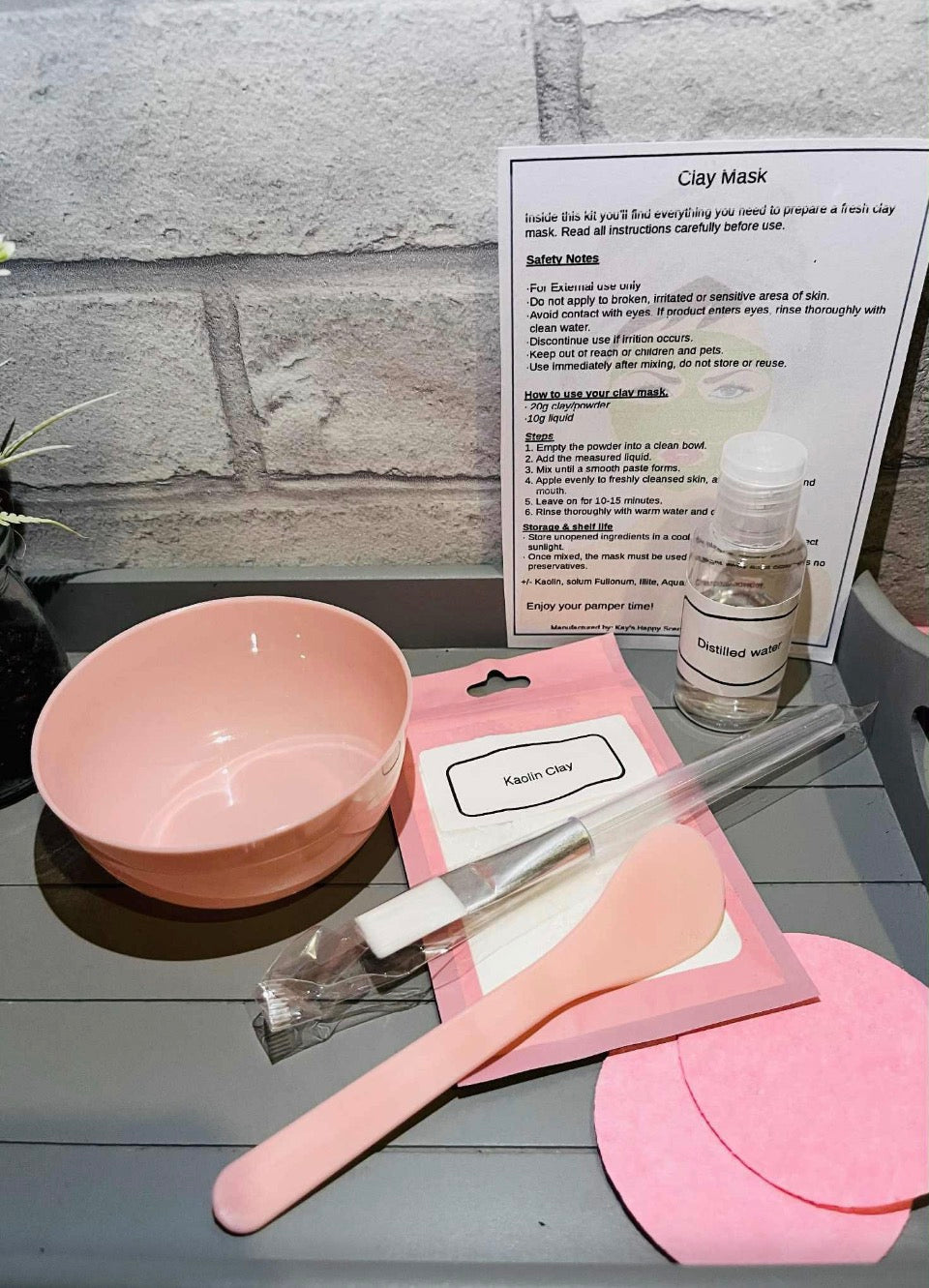 Kaolin clay face mask kit with pink bowl, spatula, brush, pads and distilled water
